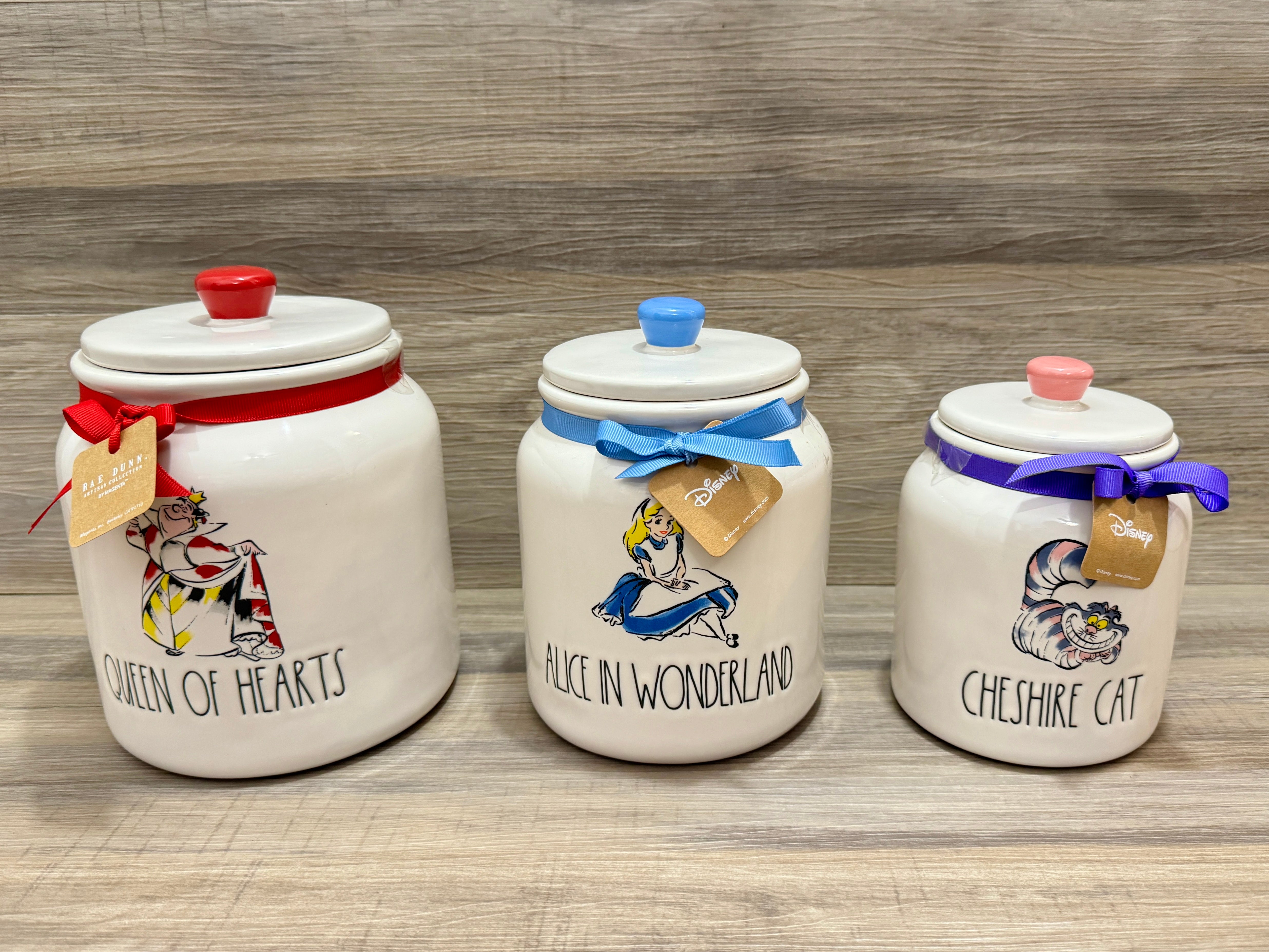 Rae purchases Dunn Alice In Wonderland Canisters